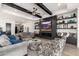 Living area with fireplace, built-ins, hardwood floors, and access to patio at 21354 W Minnezona Ave, Buckeye, AZ 85396