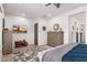 Main bedroom with plush carpeting, large dresser, and views to the backyard at 21354 W Minnezona Ave, Buckeye, AZ 85396