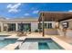 Covered patio with outdoor kitchen, grill, and TV for entertaining at 21354 W Minnezona Ave, Buckeye, AZ 85396