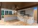 Covered patio with built-in outdoor kitchen and appliances at 21354 W Minnezona Ave, Buckeye, AZ 85396
