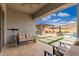 Covered patio with seating area and views of the pool and mountains at 21354 W Minnezona Ave, Buckeye, AZ 85396