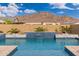 Stunning pool with water feature and mountain views at 21354 W Minnezona Ave, Buckeye, AZ 85396
