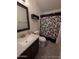 Bathroom boasts vanity with granite countertop at 215 N Power Rd # 404, Mesa, AZ 85205