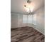 Dining area with wood flooring, a chandelier, and plantation shutters at 215 N Power Rd # 404, Mesa, AZ 85205