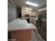 Kitchen with stainless steel appliances and an island at 215 N Power Rd # 404, Mesa, AZ 85205