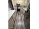 Bright kitchen featuring stainless steel appliances and wood-look flooring at 215 N Power Rd # 404, Mesa, AZ 85205