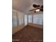 Bright sunroom featuring tiled floors and a ceiling fan at 215 N Power Rd # 404, Mesa, AZ 85205