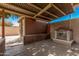 Backyard features a covered patio and a small shrine at 2234 N 50Th Dr, Phoenix, AZ 85035