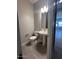 Powder room with pedestal sink and gray tile floor at 3290 W San Cristobal Rd, San Tan Valley, AZ 85144