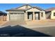 One-story home with gray exterior, two-car garage, and stone accents at 3290 W San Cristobal Rd, San Tan Valley, AZ 85144