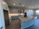 Spacious kitchen with large island, granite countertops, and light gray cabinets at 3290 W San Cristobal Rd, San Tan Valley, AZ 85144