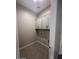 Laundry room with upper cabinets and vinyl flooring at 3290 W San Cristobal Rd, San Tan Valley, AZ 85144