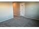 Bright living room with neutral carpeting and door to backyard at 3290 W San Cristobal Rd, San Tan Valley, AZ 85144