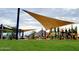 Community playground with shade structures and play equipment at 3290 W San Cristobal Rd, San Tan Valley, AZ 85144