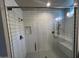 Large walk-in shower with white tile and built-in seat at 3290 W San Cristobal Rd, San Tan Valley, AZ 85144