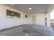 Covered back patio with concrete flooring and exterior access at 3350 W Wethersfield Rd, Phoenix, AZ 85029