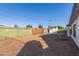 Large backyard with dirt and wooden fence at 3350 W Wethersfield Rd, Phoenix, AZ 85029
