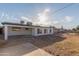Backyard with gravel and partial view of home at 3350 W Wethersfield Rd, Phoenix, AZ 85029