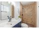 Clean bathroom with updated vanity, tile shower, and modern fixtures at 3350 W Wethersfield Rd, Phoenix, AZ 85029