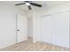 Bedroom with ceiling fan, sliding door closet and an additional door to another room at 3350 W Wethersfield Rd, Phoenix, AZ 85029