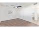 Bright bedroom with ceiling fan, closet and wood-look laminate flooring at 3350 W Wethersfield Rd, Phoenix, AZ 85029