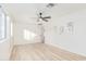 Spacious bedroom with ceiling fan and wood-look floors at 3350 W Wethersfield Rd, Phoenix, AZ 85029