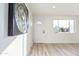 Bright entryway with white door and wood-look floors at 3350 W Wethersfield Rd, Phoenix, AZ 85029