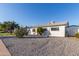White single story home with cacti and rock landscaping at 3350 W Wethersfield Rd, Phoenix, AZ 85029