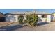 White single story home with cacti and rock landscaping at 3350 W Wethersfield Rd, Phoenix, AZ 85029