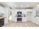Bright kitchen, featuring white cabinets, stainless steel appliances, and wood countertops at 3350 W Wethersfield Rd, Phoenix, AZ 85029