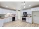 Remodeled kitchen featuring white shaker cabinets, butcher block countertops, and stainless steel appliances at 3350 W Wethersfield Rd, Phoenix, AZ 85029