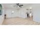 Open living room with built-in shelving and kitchen view at 3350 W Wethersfield Rd, Phoenix, AZ 85029