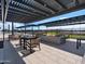 Relaxing fire pit area with seating under a pergola at 3650 E Alexander Dr, San Tan Valley, AZ 85143