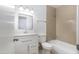 Clean bathroom with white vanity, bathtub, and tile shower surround at 4047 W Reade Ave, Phoenix, AZ 85019