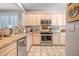 Kitchen with granite countertops and stainless steel appliances at 41101 N Sutter Ln, Anthem, AZ 85086