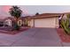 House exterior showcasing a driveway and desert landscaping at 4524 E Villa Maria Dr, Phoenix, AZ 85032