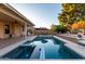 Expansive pool with spa, patio furniture, and a red umbrella at 4524 E Villa Maria Dr, Phoenix, AZ 85032