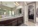 Elegant bathroom featuring double vanities and a large mirror at 6260 S Fresno St, Chandler, AZ 85249