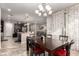 Open concept dining room with kitchen views and red accent cushions at 6260 S Fresno St, Chandler, AZ 85249