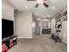 Spacious loft area with TV, exercise equipment, and carpeted floors at 6260 S Fresno St, Chandler, AZ 85249