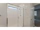 Large walk-in shower with window and modern fixtures at 6327 S 34Th Dr, Phoenix, AZ 85041