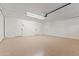 Bright garage featuring white painted walls and epoxy flooring at 6802 N 22Nd Pl, Phoenix, AZ 85016