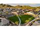 Aerial view of community showing homes, park, and mountain backdrop at 7371 W Whitehorn Trl, Peoria, AZ 85383