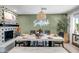 Bright dining area featuring a concrete table, statement wall, and stylish decor at 7502 E Latham St, Scottsdale, AZ 85257