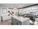 Spacious kitchen island with white quartz countertops and gray cabinets at 7502 E Latham St, Scottsdale, AZ 85257