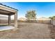 Large backyard with a covered patio and plenty of space for outdoor activities at 8737 S 253Rd Dr, Buckeye, AZ 85326