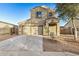 Two-story house with a two-car garage and a beautifully landscaped front yard at 8737 S 253Rd Dr, Buckeye, AZ 85326