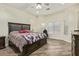 Large main bedroom with wood flooring and a ceiling fan at 10101 E Posada Ave, Mesa, AZ 85212