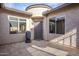 Front courtyard with a water feature and a security door at 10786 E Lazy Doc Ct, Gold Canyon, AZ 85118