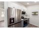 Stainless steel appliances and gray cabinets in this modern kitchen at 12440 W Eveningside Dr, Sun City West, AZ 85375